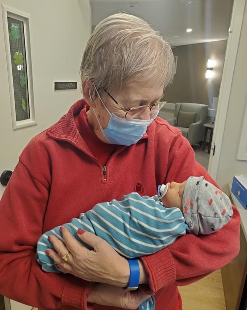 Patient with Alzheimer's dementia holding a reborn baby doll. What are reborn dolls for? Who buys reborns and how can they help? What's the point of reborns? Why do people buy reborn dolls?