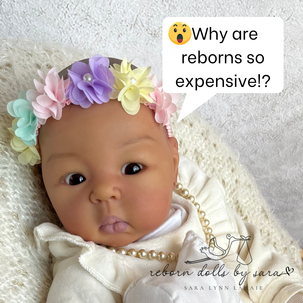 Sparrow, reborn cuddle baby made by Reborn Dolls by Sara from the Suu Kyi kit by Adrie Stoete, saying "why are reborns so expensive?" for a blog called "why reborn dolls cost so much."