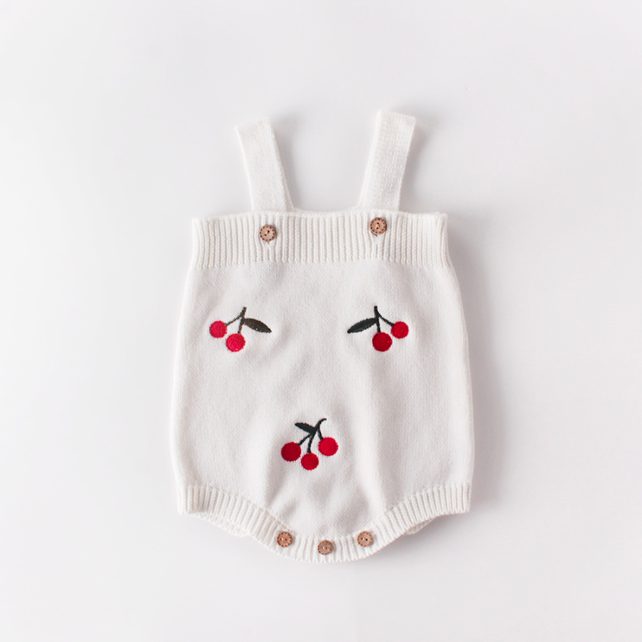 White knitted overall romper onesie with embroidered cherries on it for babies and reborn dolls.