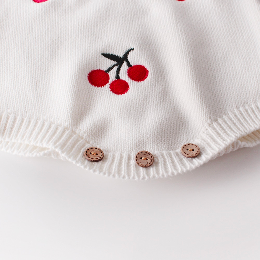 Knitted overall romper and cardigan set for newborn babies and reborn dolls with red embroidered cherries.