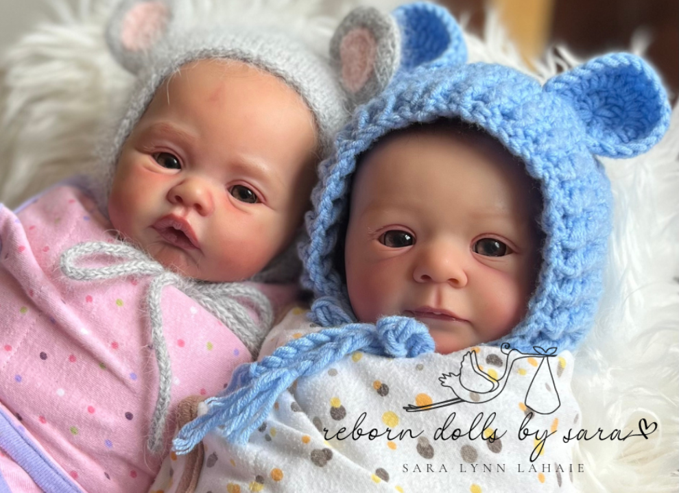 Reborn baby boy doll Felicia by Gudrun Legler wearing the blue Cutie Pie Crochet Newborn Baby Bear Bonnet with Matching Stuffy