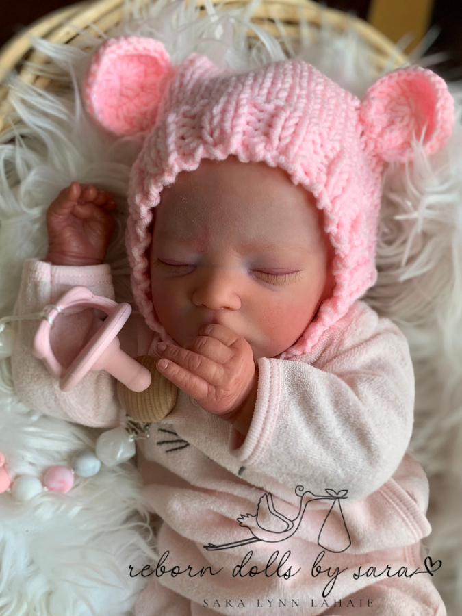 Reborn doll realborn Darren sleeping by Bountiful Baby as a girl wearing the pink Lovey hand knitted newborn baby bear hat with matching teddy.