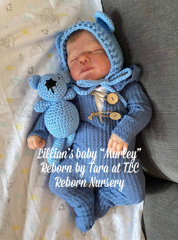 Reborn doll Marley by Cassie Brace reborn by Tara Cormier from TLC Reborn Nursery wearing the blue Cutie Pie Crochet Newborn Baby Bear Bonnet with Matching Stuffy.