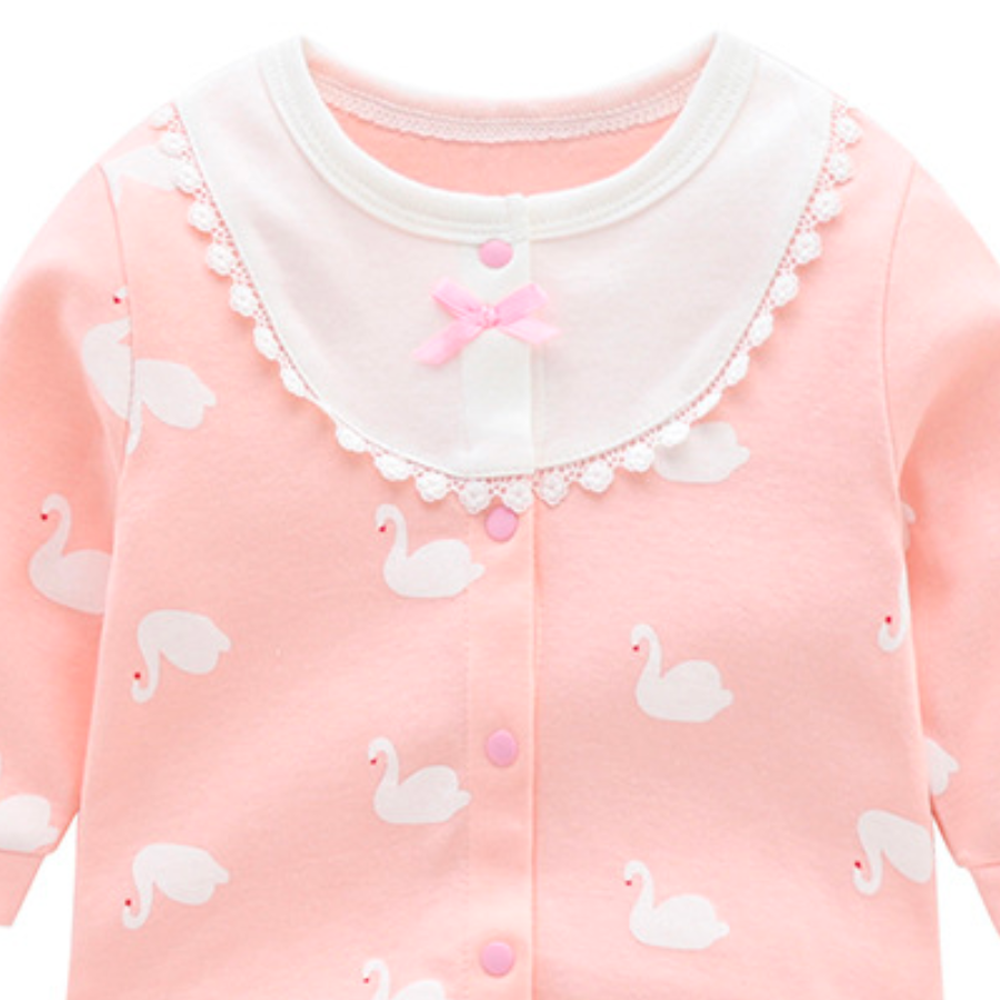 Pink newborn size button down long sleeve cotton romper with white collar and white swans for reborn dolls, baby girls, newborn babies, cuddle babies.