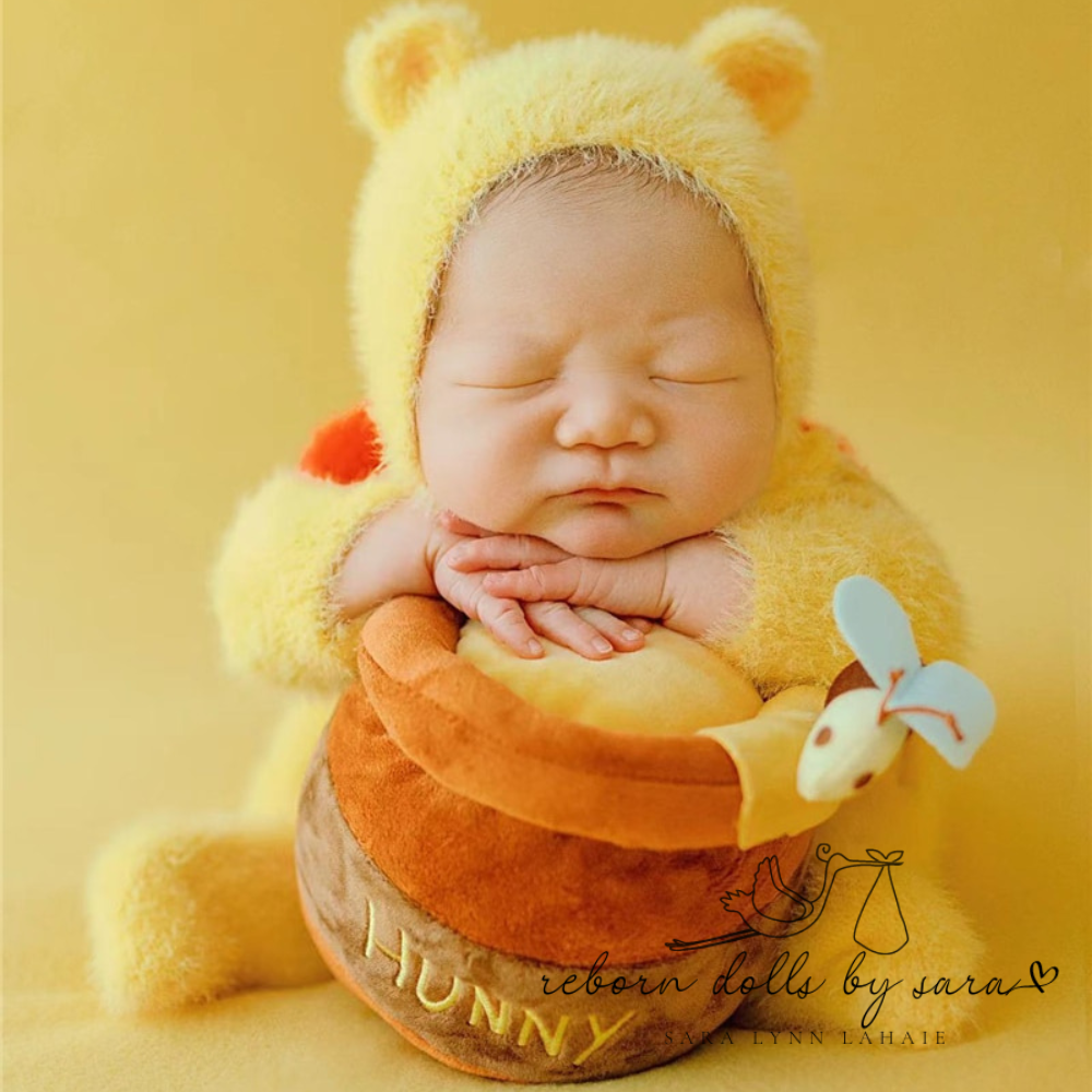 Fuzzy Winnie the Pooh newborn photography baby romper and matching bonnet for reborn dolls.