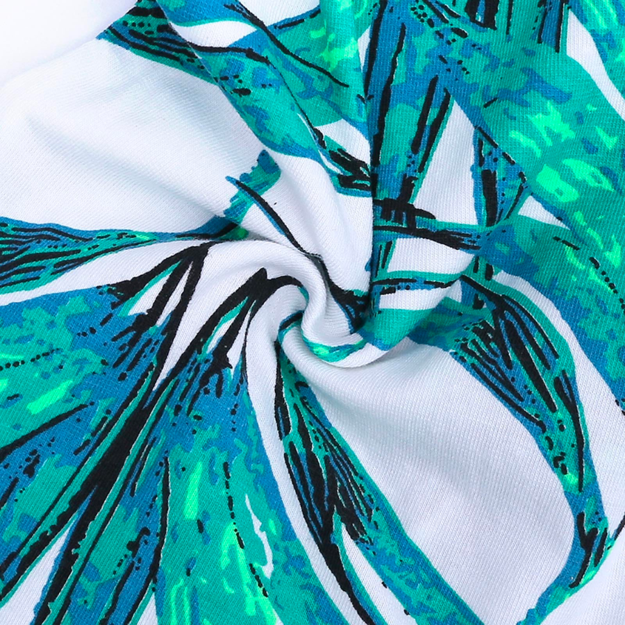 Green botanical leaves on a white sleep n' play coverall zip-up romper with feeties for baby girls, reborn dolls, and cuddle babies.