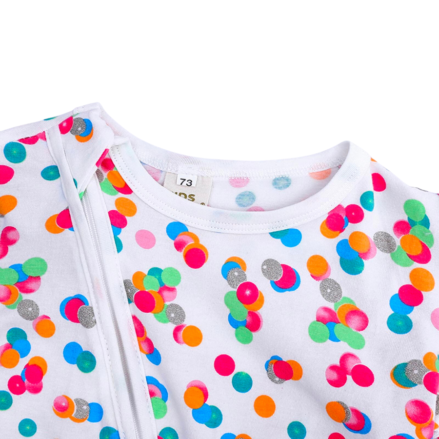 Colorful polka dots on a white sleep n' play coverall zip-up romper with feeties for baby girls, reborn dolls, and cuddle babies.