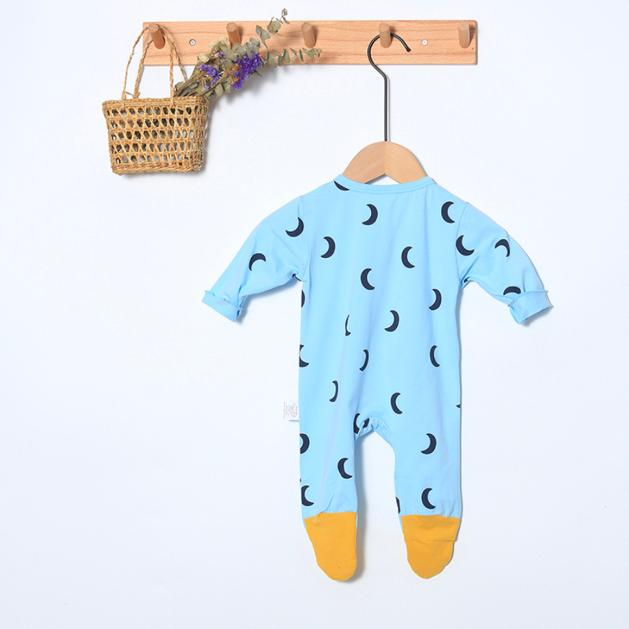 Light blue long-sleeve button-up romper with mustard yellow toe tips and black moon crescent designs. Comes with a matching pixie bonnet hat with a drawstring for babies and reborn dolls.