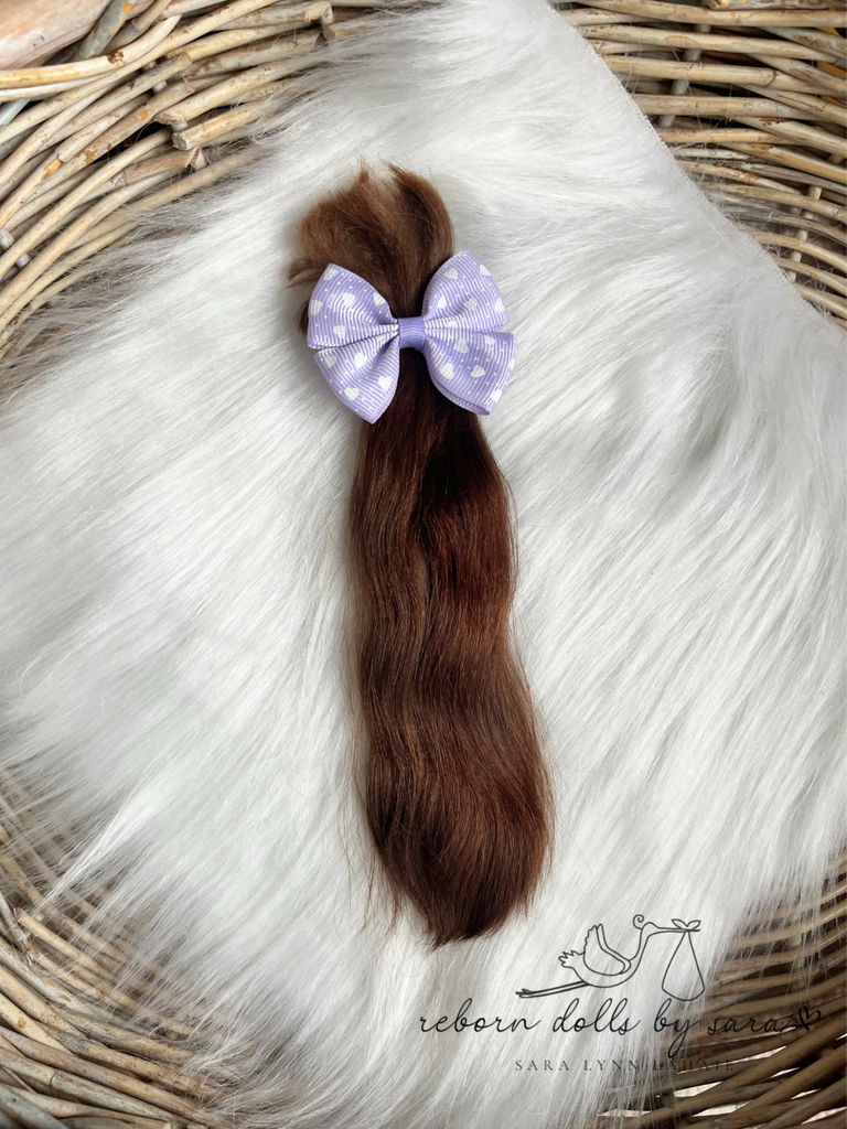 Premium yearling angora goat mohair for rooting highly realistic ooak dolls.  Medium chestnut brown.  Medium brown with reddish copper highlights. Reborning supplies doll hair reborns. High end reborns. Reborn Dolls by Sara.