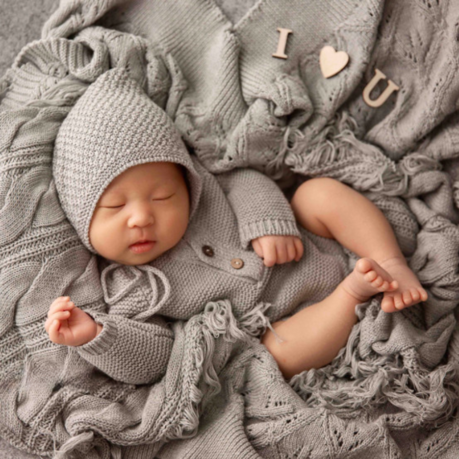 Newborn baby boy wearing the grey crochet knitted newborn baby longsleeve bodysuit onesie with pixie bonnet for reborn dolls and babies. Baby shower gift. Expectant mom mother to be gift. Crochet newborn baby bodysuit onesie pixie bonnet. Reborn clothing. Reborn Clothes.