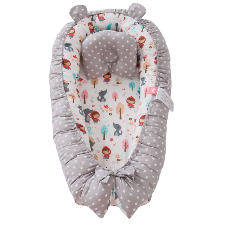 Portable baby lounger nest pillow for reborn doll displays.