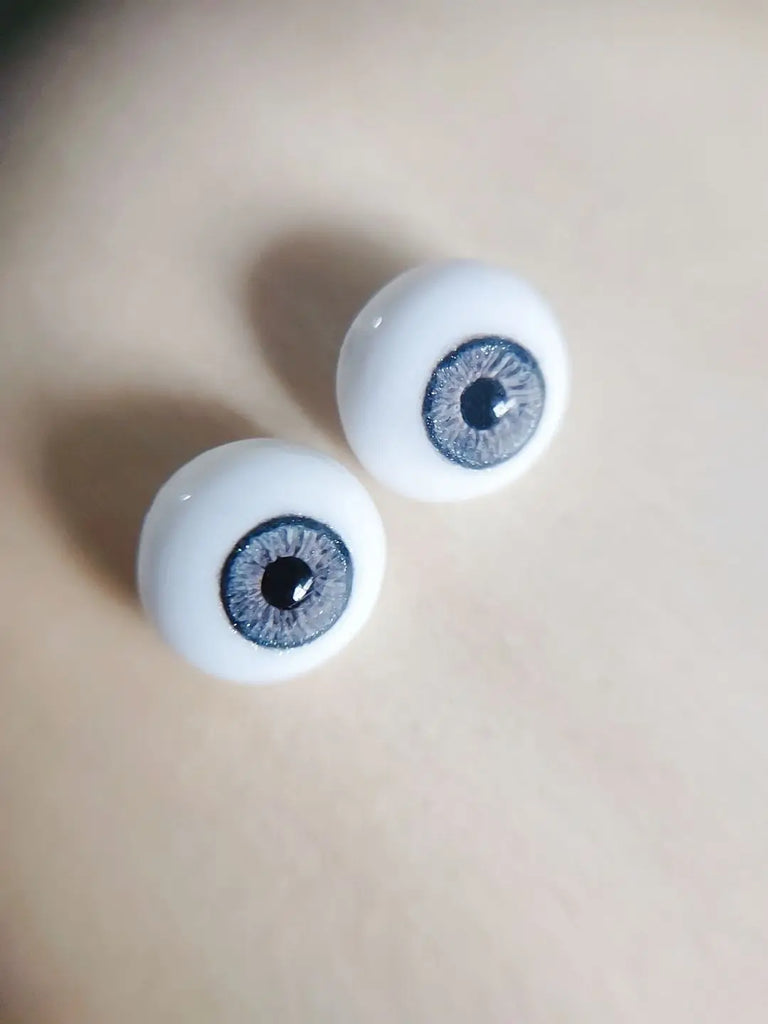 Fantasy blue eyes with a dark blue sparkly ring around them for reborn dolls. Full round plaster eyes for reborn dolls, BJD dolls, Blythe dolls etc.