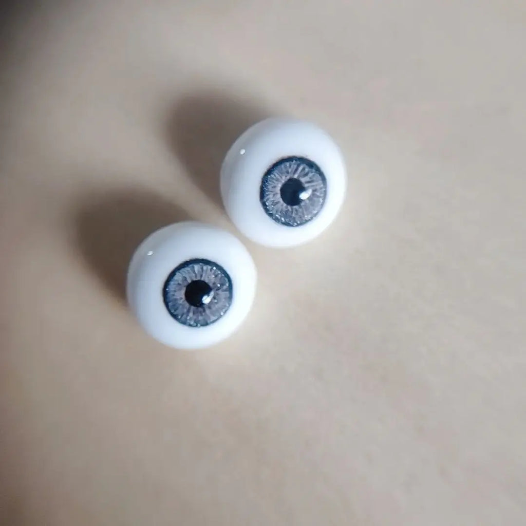 Fantasy blue eyes with a dark blue sparkly ring around them for reborn dolls. Full round plaster eyes for reborn dolls, BJD dolls, Blythe dolls etc.