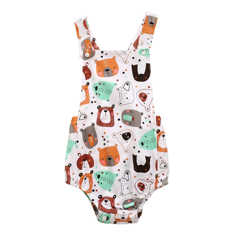 White cotton newborn baby overalls rompers onesies for babies and reborn dolls featuring dinosaurs, winter bears wearing scarves, bears and rainbows and other forest animals. Dinosaurs for girls.