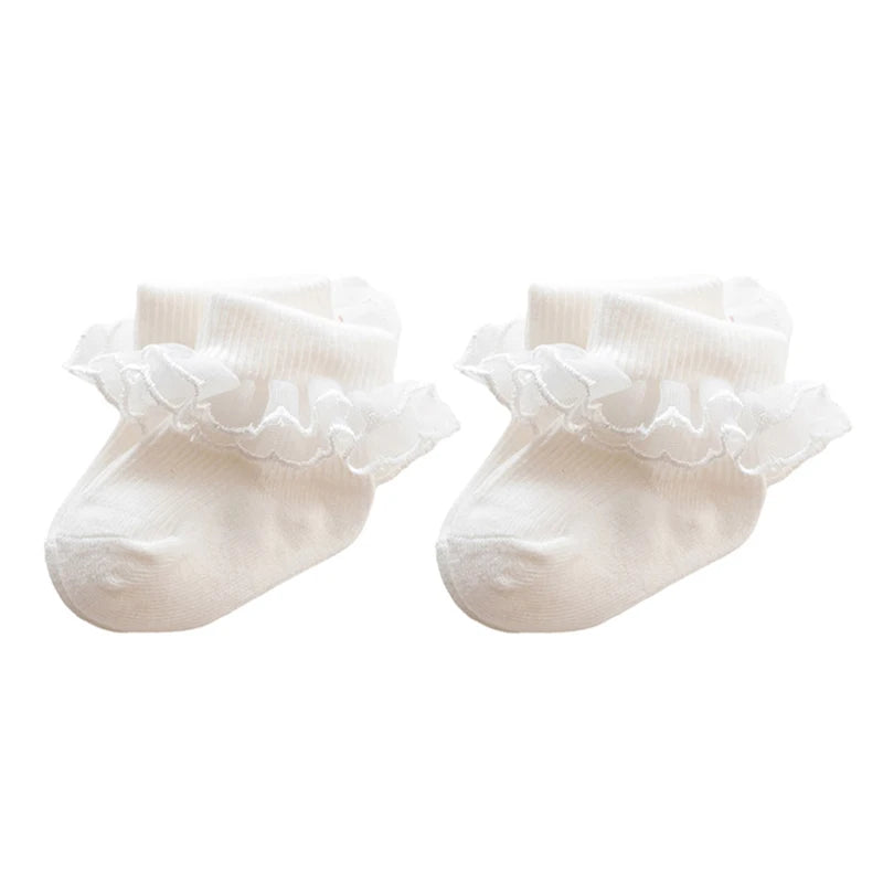Newborn spanish vintage baby socks for girls and reborn dolls. Lace trim at the ankle.