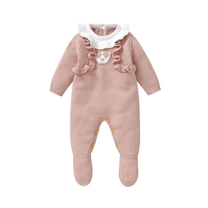 Pink footed cable knit romper for reborn dolls with white Peter Pan collar and white princess crown on the chest with a pink heart in the centre.