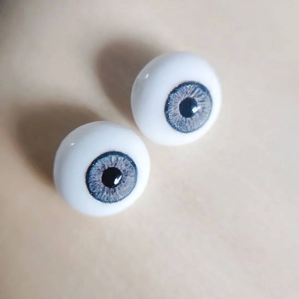 Fantasy blue eyes with a dark blue sparkly ring around them for reborn dolls. Full round plaster eyes for reborn dolls, BJD dolls, Blythe dolls etc.