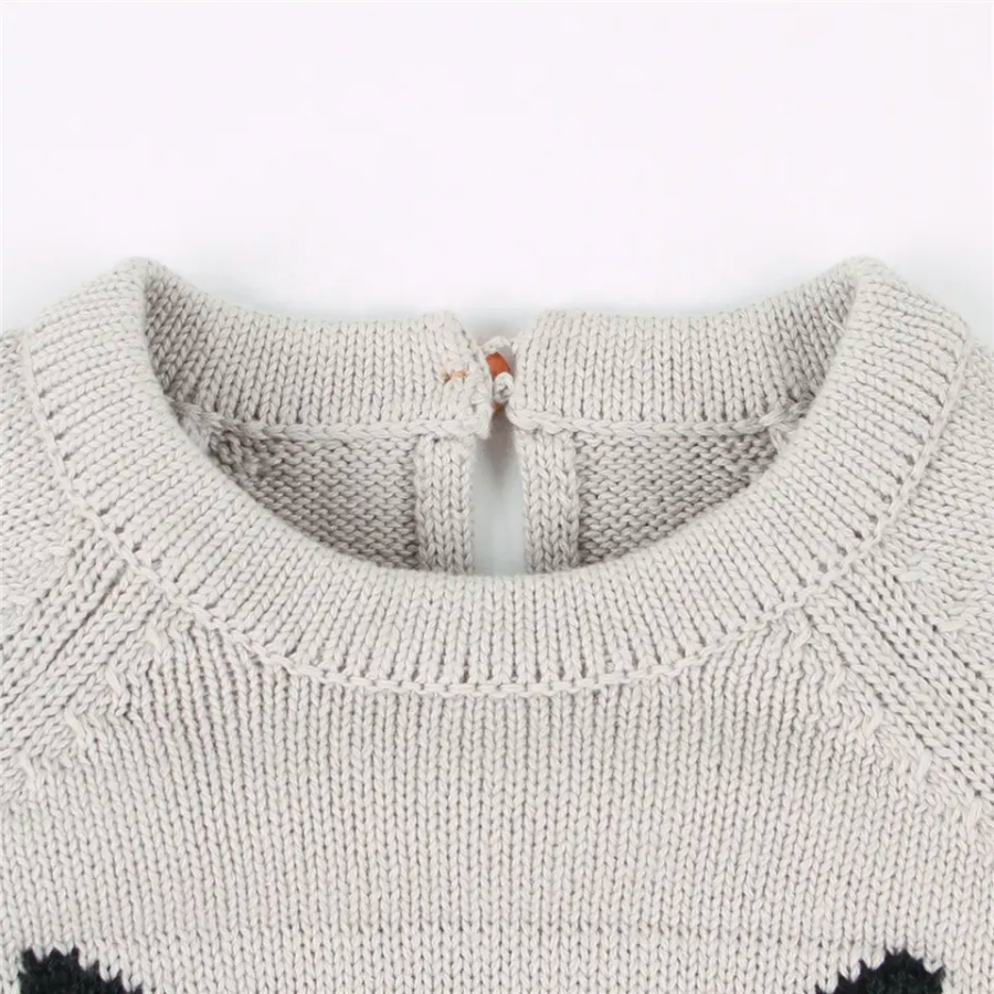 Close-up of the neckline and collar area of a grey knitted long-sleeve sweater onesie romper for reborn baby dolls.