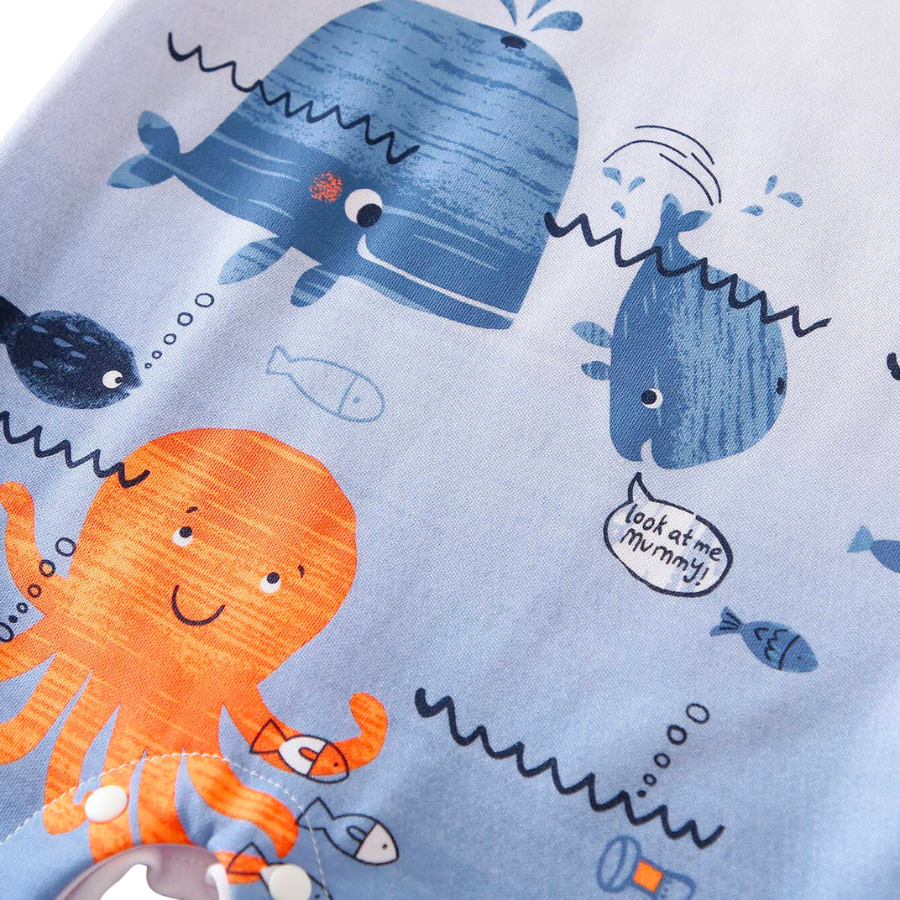 White long-sleeve romper with blue whales, water, orange octopi, and a submarine on it for reborn baby boys.