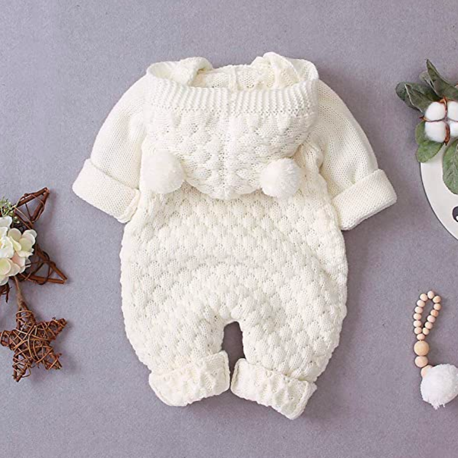 Backside of a white knitted long-sleeve button-down teddy bear romper with hood and two pompom bear ears for reborn baby dolls.