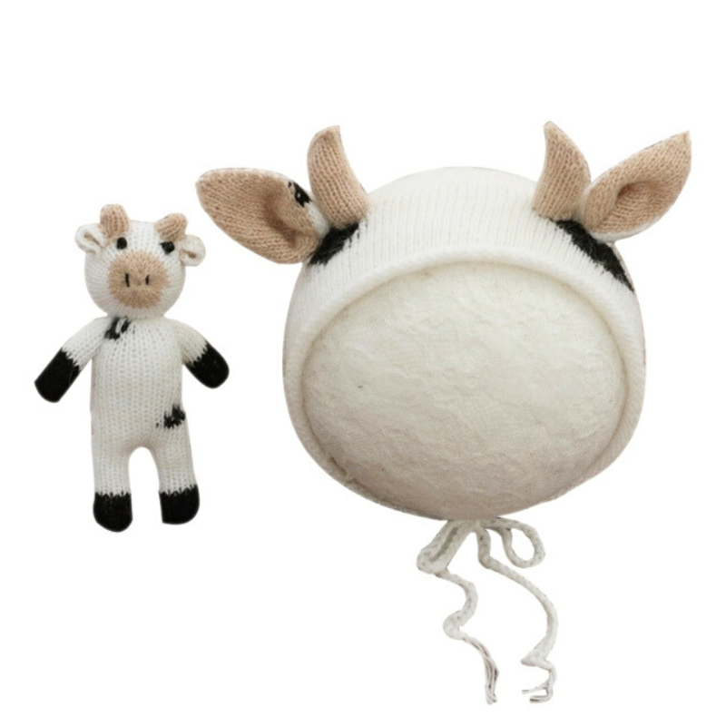 Black and White knitted crochet cow hat and matching cow stuffie for reborn dolls, newborn photography, reborn photoshoots, and cuddle babies.
