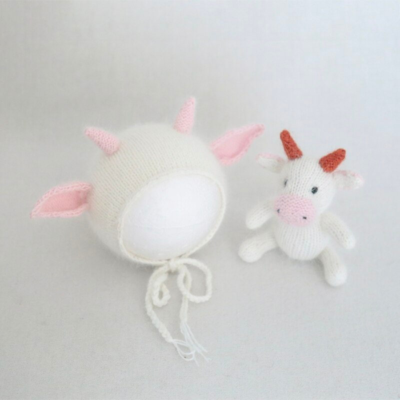 Knitted pink and white cow hat for reborn and newborn photography with matching stuffie.