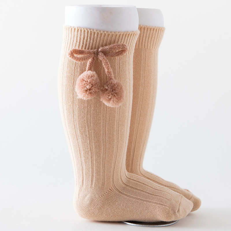 Oatmeal beige khaki knee-high Spanish baby socks with pompoms for reborn baby dolls boys and girls.