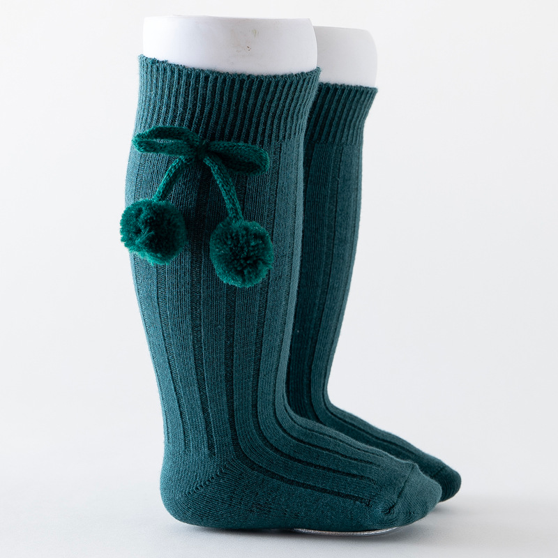Emerald green forest dark knee-high Spanish baby socks with pompoms for reborn baby dolls boys and girls.