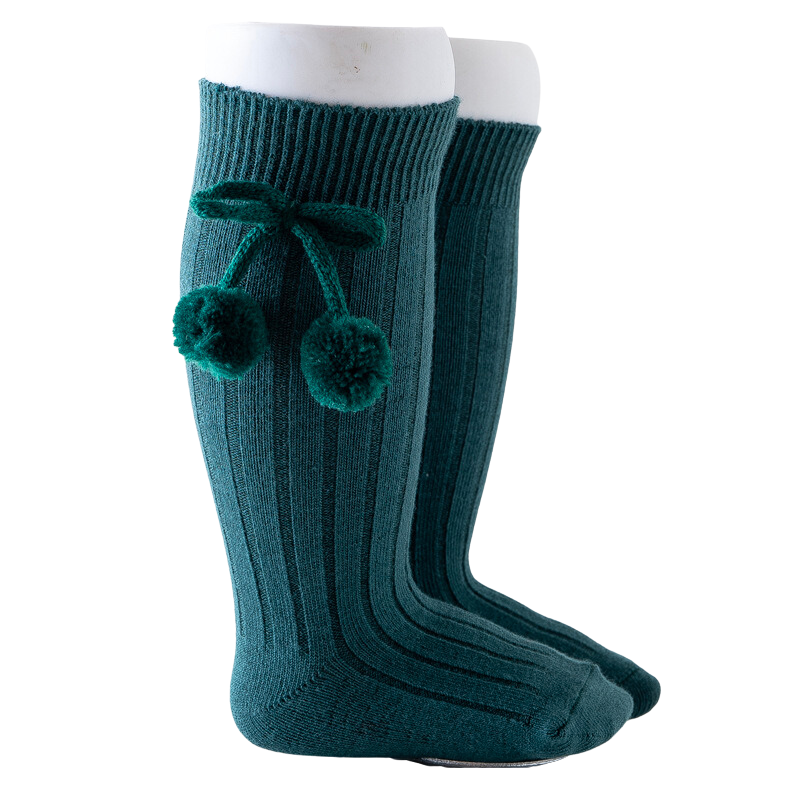 Dark forest emerald green knee-high Spanish baby socks with pompoms for reborn baby dolls boys and girls.