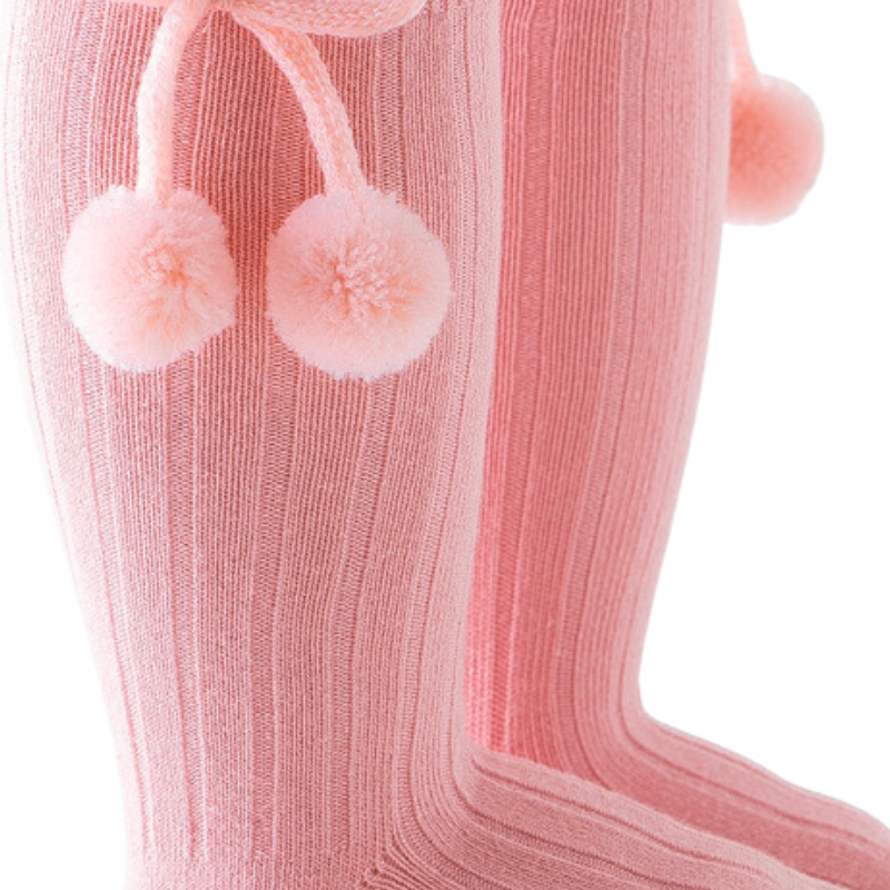 Pink knee-high Spanish baby socks with pompoms for reborn baby dolls boys and girls.
