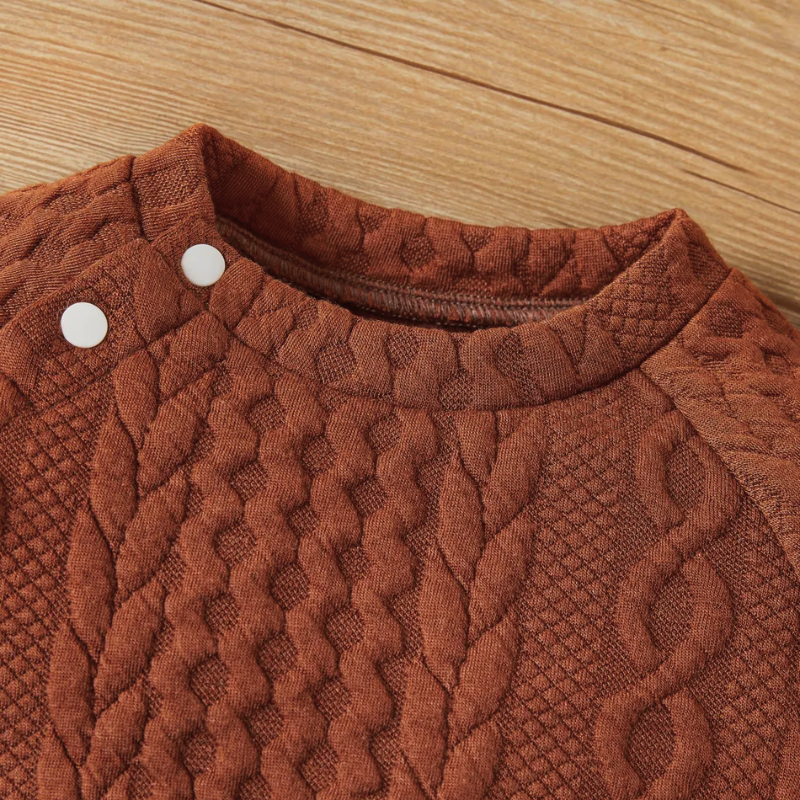 Brown ginger terra cotta caramel coloured cable knitted pullover two piece outfit with matching pants for reborn dolls or cuddle babies or newborn babies. Hand knit gender neutral newborn baby outfit.