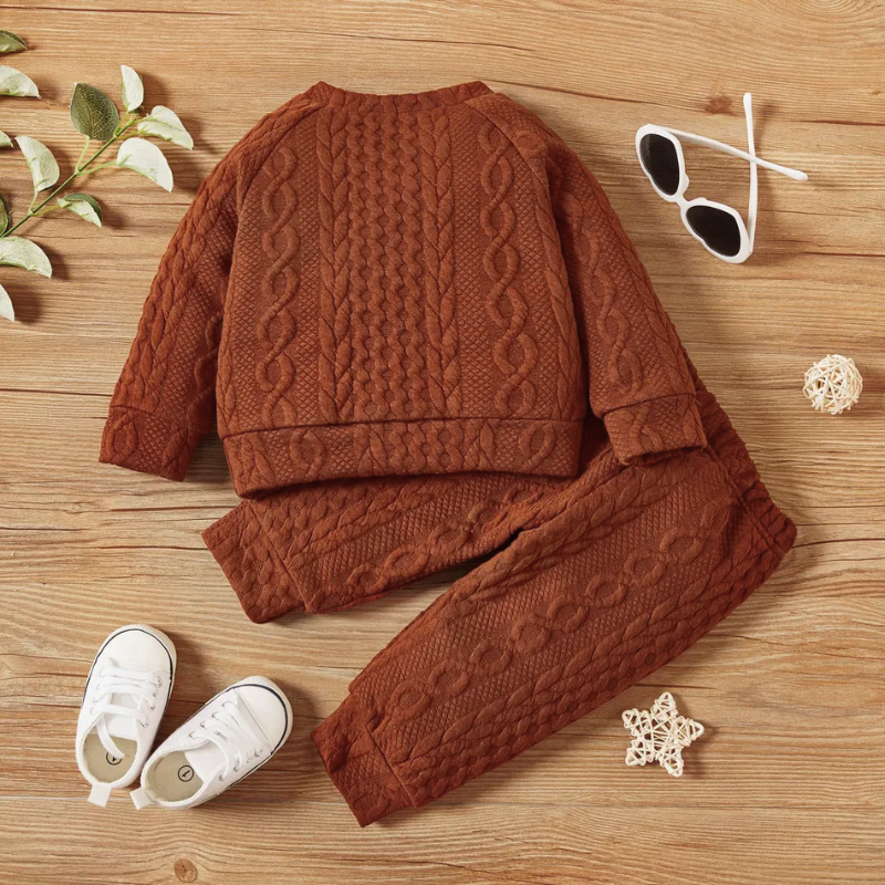 Brown ginger terra cotta caramel coloured cable knitted pullover two piece outfit with matching pants for reborn dolls or cuddle babies or newborn babies. Hand knit gender neutral newborn baby outfit.