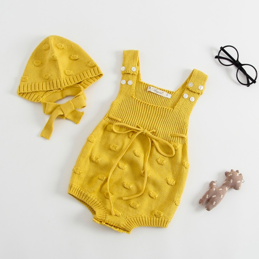Mustard yellow knitted overall onesie with dots and matching bonnet for baby girls and reborn dolls.