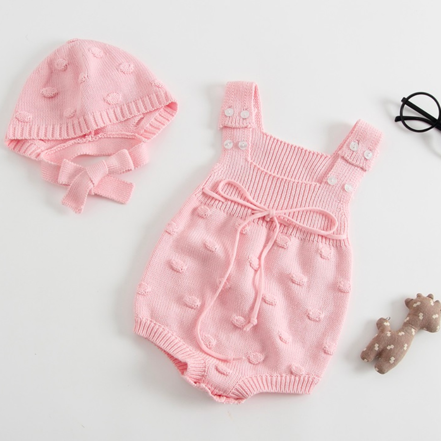 Baby pink knitted overall onesie with dots and matching bonnet for baby girls and reborn dolls.