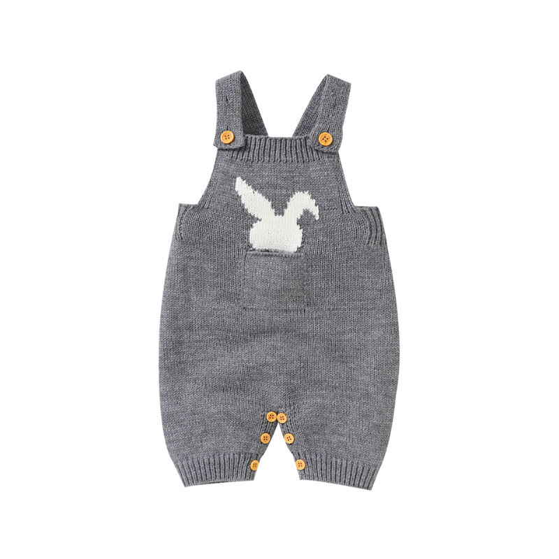 Grey knitted overall shorts with front pockets on the chest and a little white silhouette of a bunny sticking out of the pocket for newborn babies and reborn dolls.