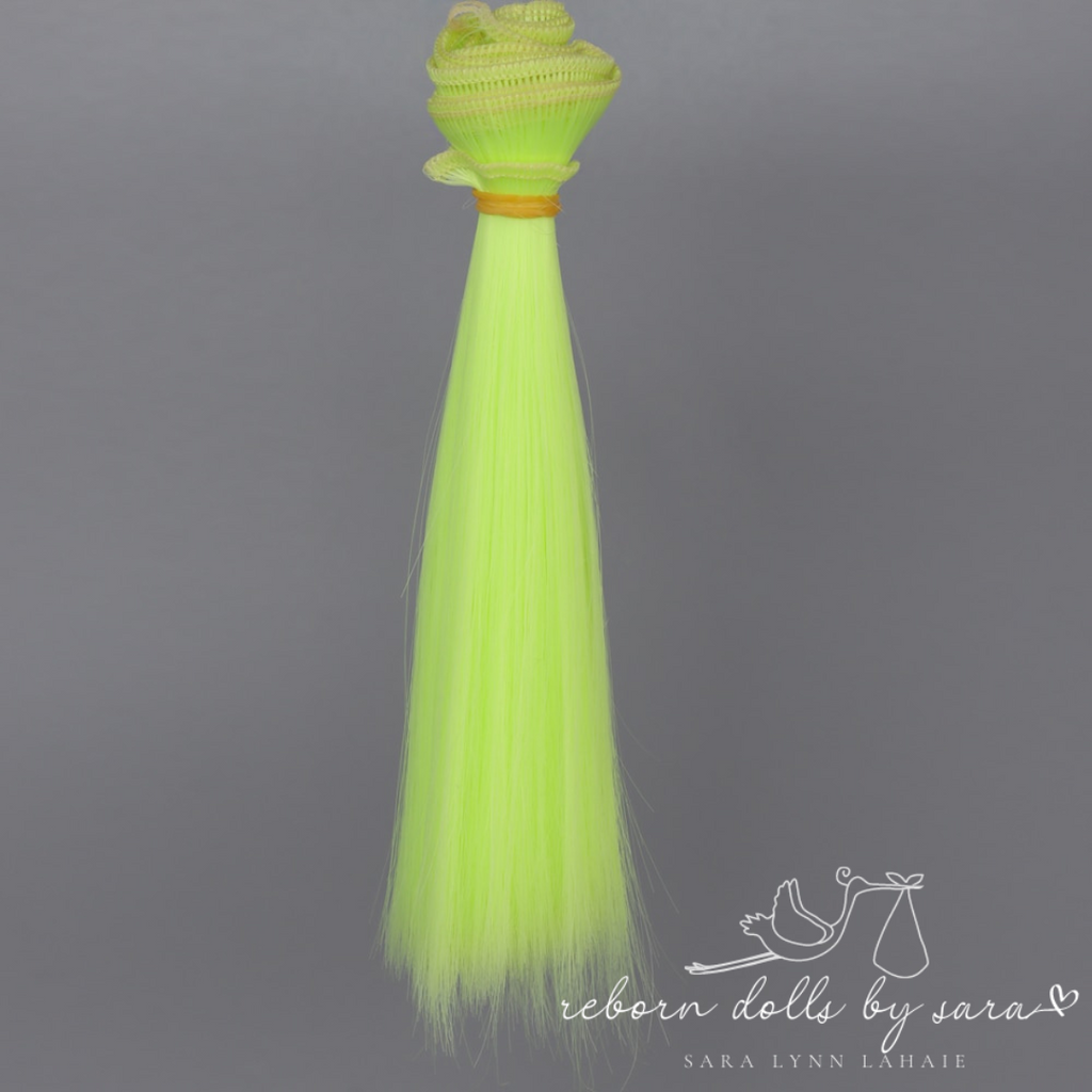 Neon yellow synthetic doll hair for alternative reborn dolls 15cm long.
