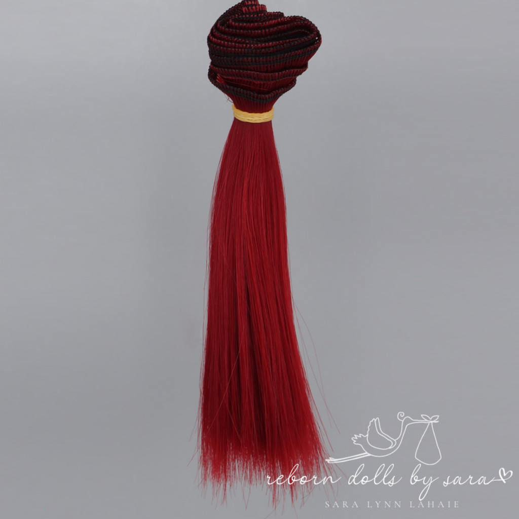 Dark red synthetic doll hair for alternative reborn dolls 15cm long.