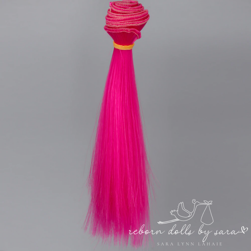 Hot pink synthetic doll hair for alternative reborn dolls 15cm long.