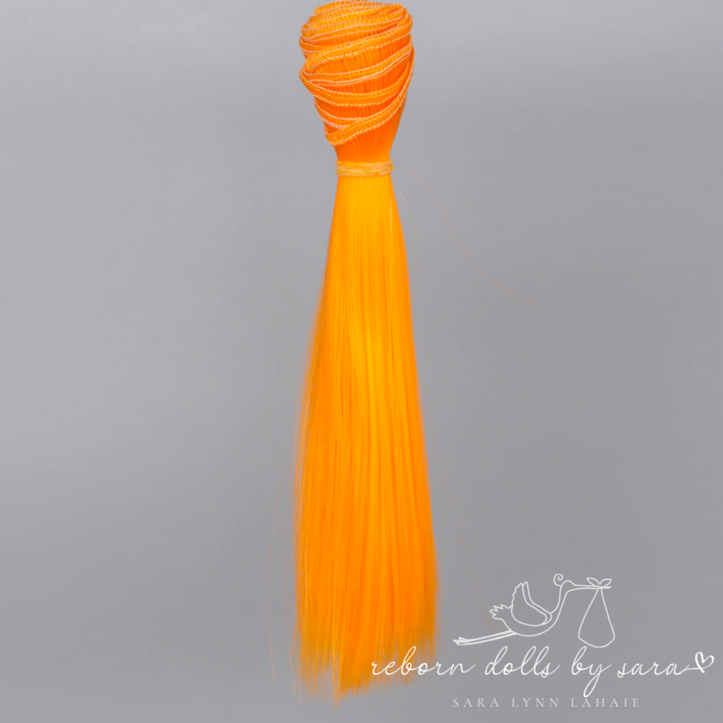 Pumpkin synthetic doll hair for alternative reborn dolls 15cm long.