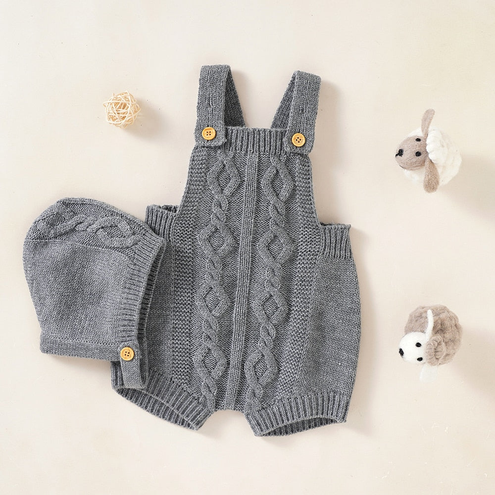 Grey coloured Spanish knitted shortalls with matching bonnet for babies and reborn dolls.