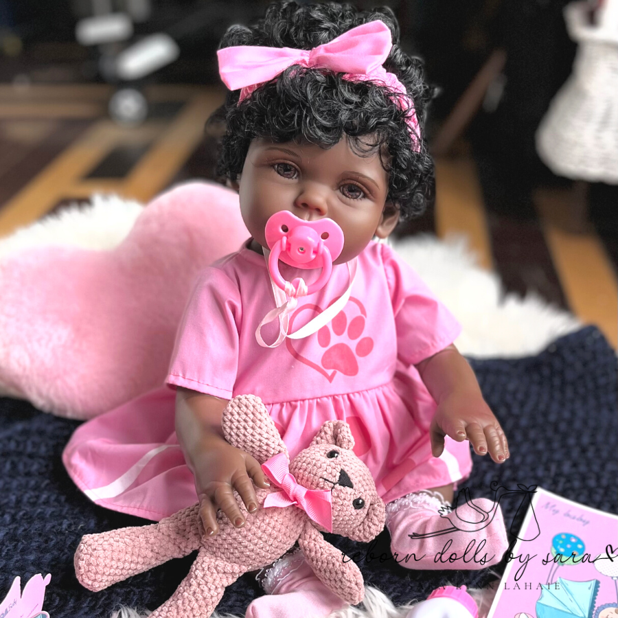 18" preemie sized affordable black reborn baby doll with drink and wet system, rooted hair and brown acrylic eyes for sale.