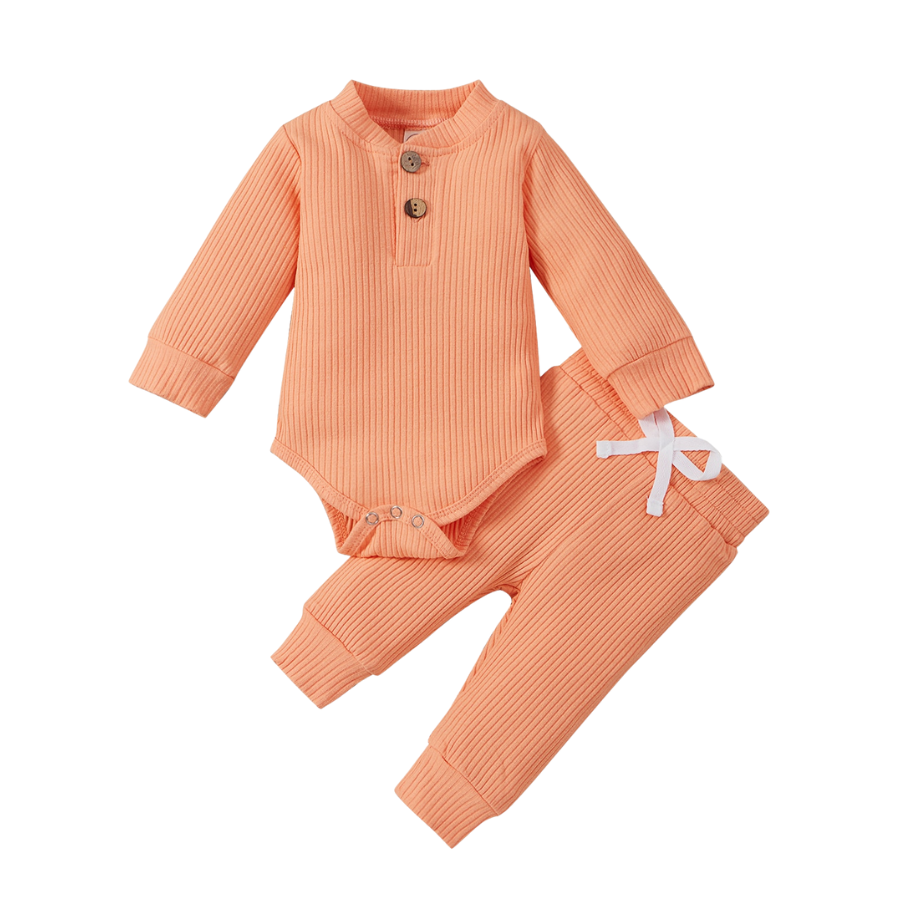 Peach coloured jogging suit for newborns and reborn baby dolls.