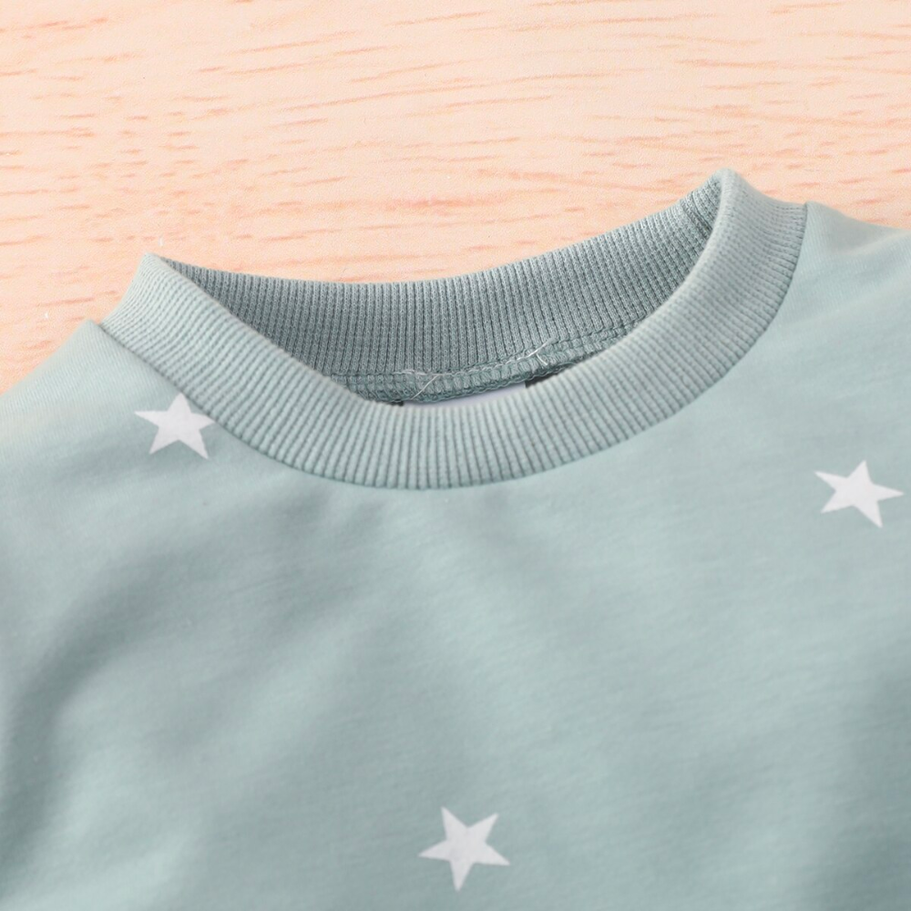 Mint green jogging suit with white stars for newborn babies and reborn baby dolls.