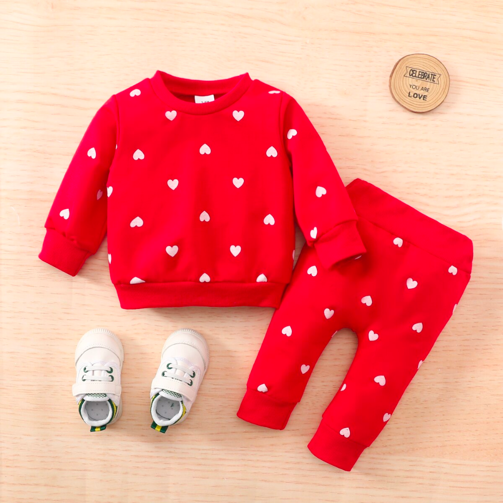 Red jogging suit with white hearts for newborn babies and reborn baby dolls.