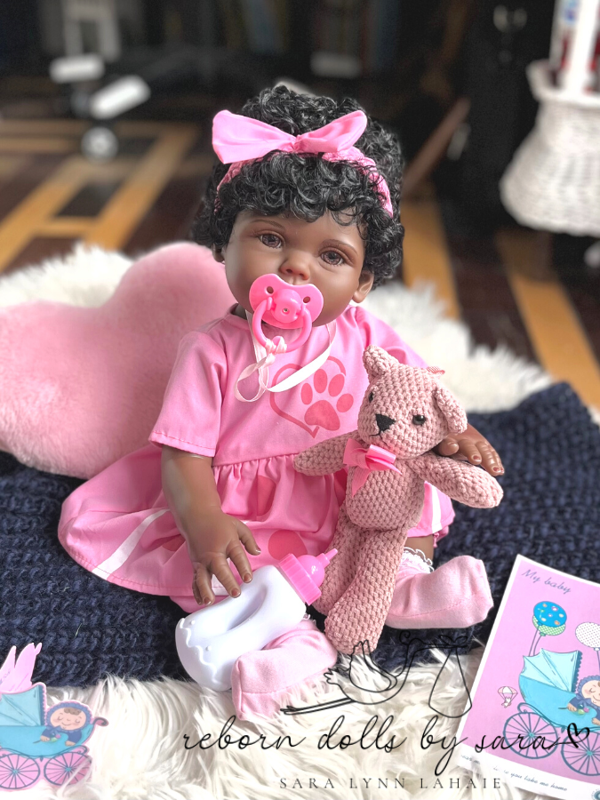 18" preemie sized affordable black reborn baby doll with drink and wet system, rooted hair and brown acrylic eyes for sale.