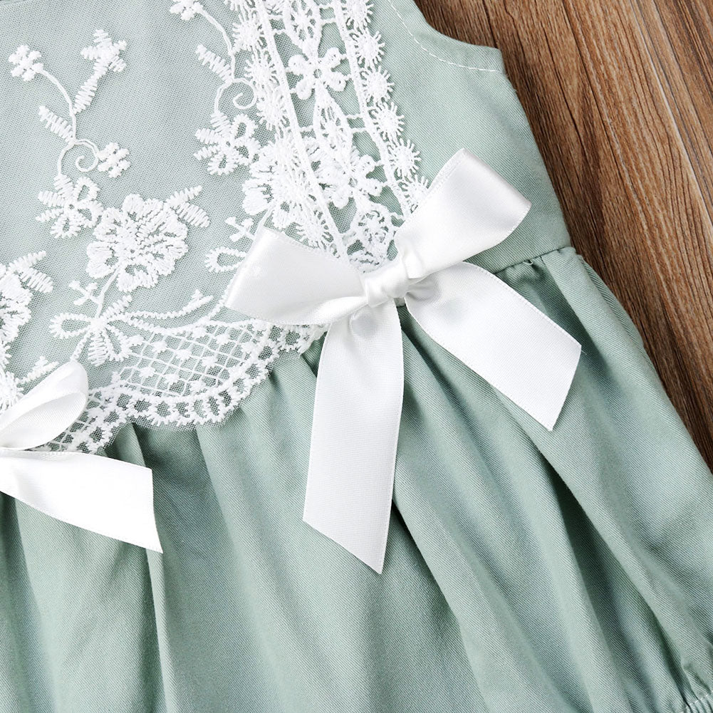 Close-up of waist lie and bows, lace on mint green Spanish baby clothing bubble romper for reborns and babies: reborn doll clothing