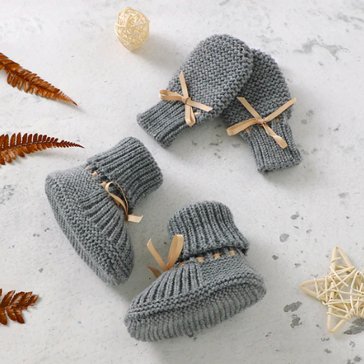 Light grey crochet knit booties and anti-scratch mitts for reborn dolls with leather drawstring.