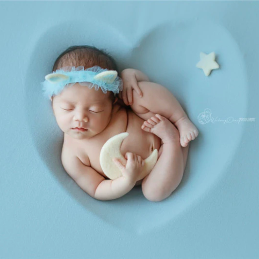 Newborn baby boy wearing a blue and white cat headband with tule around headband for newborn photography, reborn dolls, baby girls, reborns, cuddle babies and baby boys.