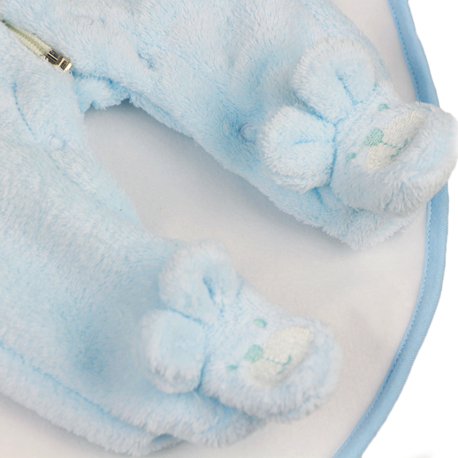 Close-up of the feet on a Blue newborn sized fleece zip-up teddy bear rompers with bear feeties attached and hoods with 3D ears and bear faces on them for reborn baby dolls.