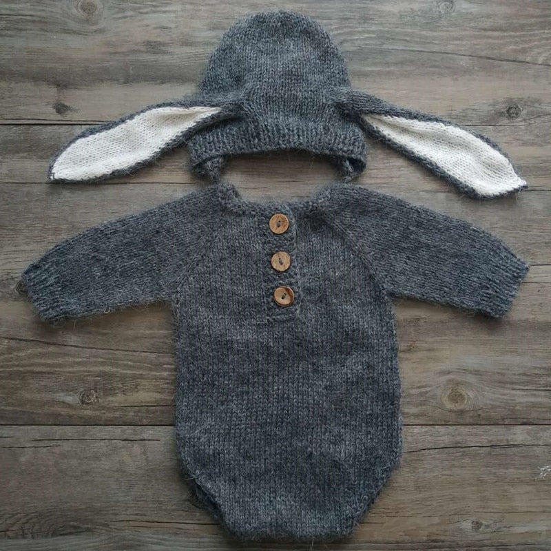 Dark grey knitted bunny rabbit newborn photography hat and long-sleeve onesie bodysuit for reborn baby dolls.